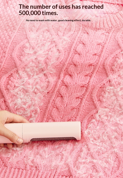 Pet hair remover demonstrated on pink fabric