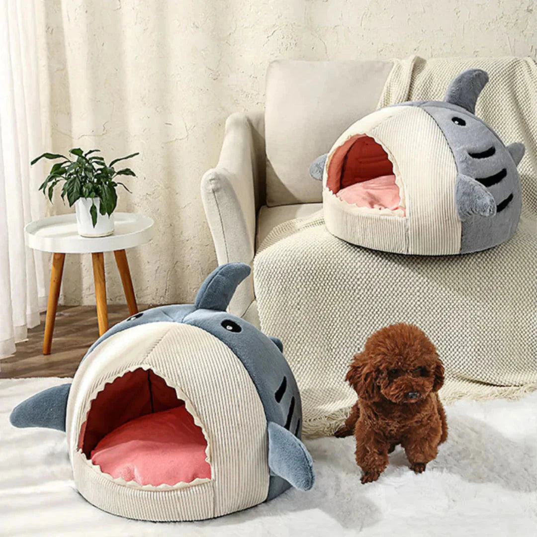 Shark pet beds placed beside a sofa for cats and small dogs