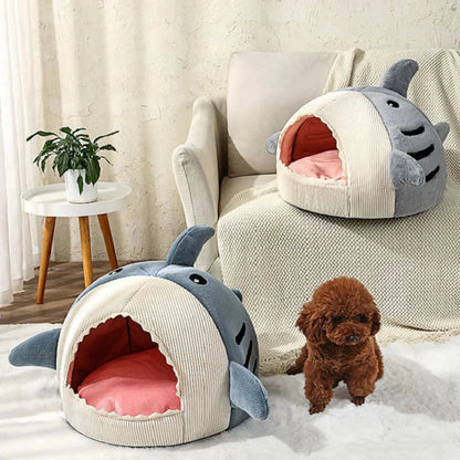 Shark pet beds placed beside a sofa for cats and small dogs
