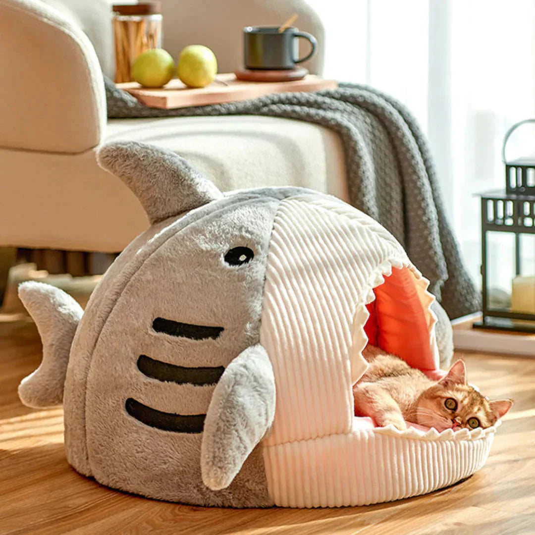 Shark-shaped cat bed with soft cushioned interior