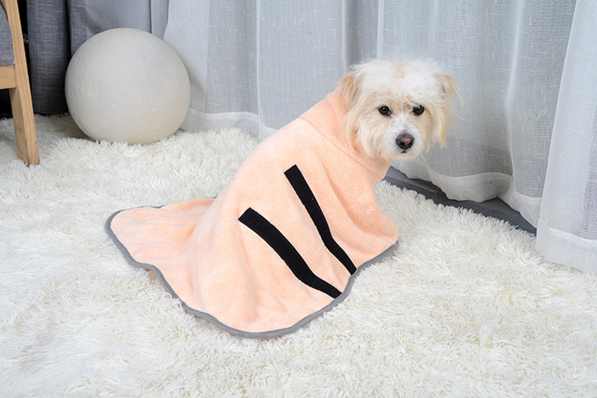 Dog wearing peach pet bathrobe with adjustable straps