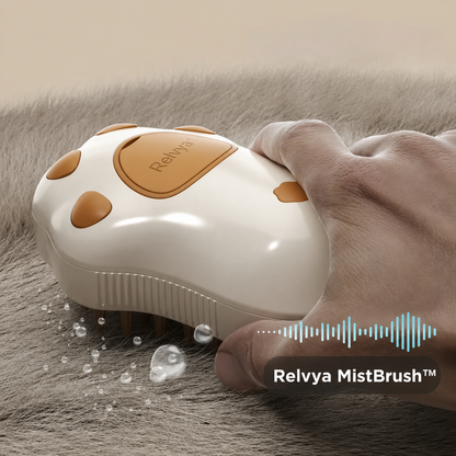 Pet grooming mist brush spraying fine mist during brushing