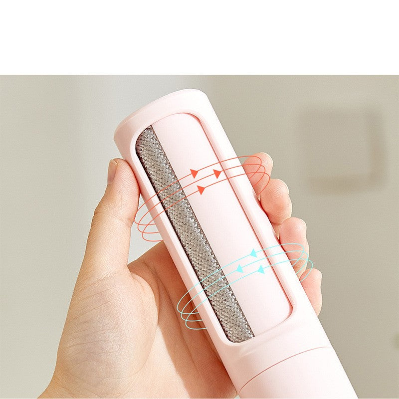 Pet hair remover demonstrated on pink fabric