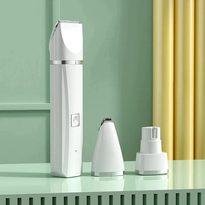 Electric pet grooming trimmer shown with accessory heads
