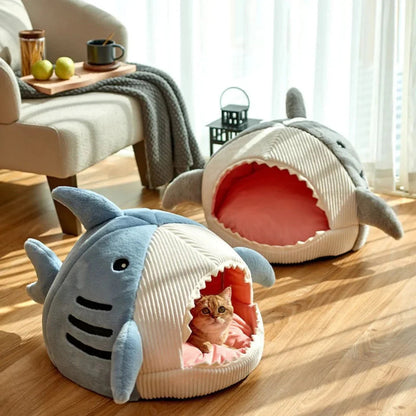 Blue shark pet beds shown in different sizes