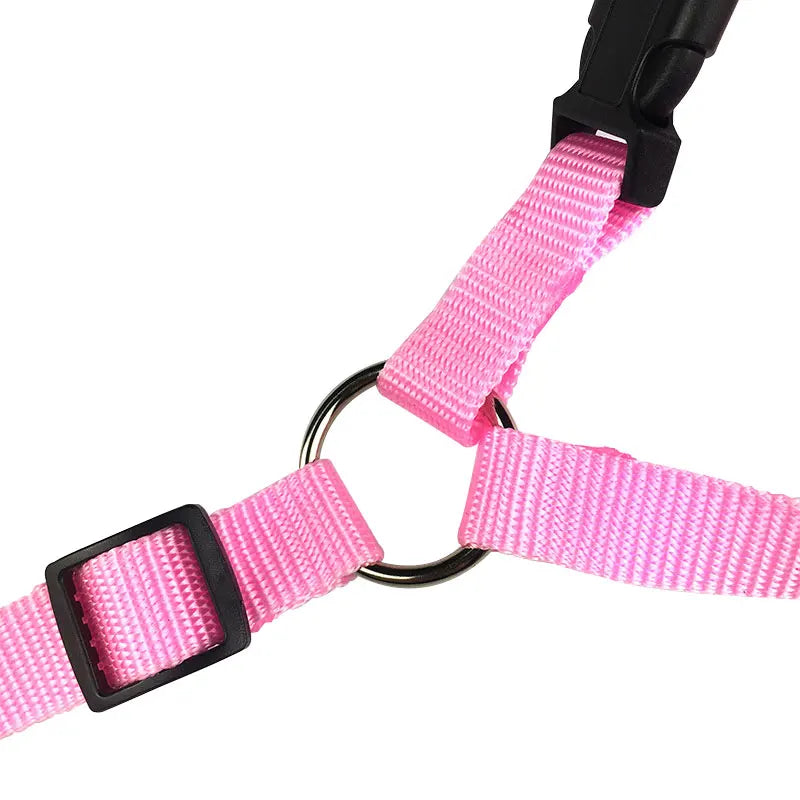 Pink adjustable pet car seat belt buckle detail